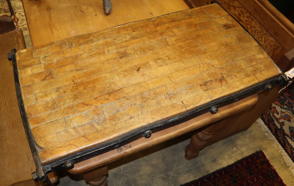 A late 19th century/early 20th century iron bound butchers block, W.96cm, D.52cm